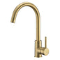 Brushed brass deck mount sink mixer by Edouard Rousseau, featuring a shiny finish, single handle for easy operation, and modern design with flow-reducing aerator for water savings.