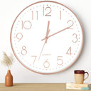 Shop the Leepat Silent 30 cm Quartz Wall Clock with Arabic Numerals. Perfect for living rooms, kitchens, and offices. Stylish rose gold finish enhances any decor.