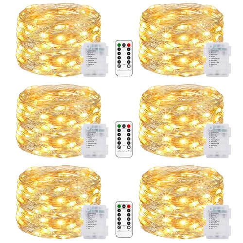Battery powered string lights in warm white, featuring six packs of twinkle lights with eight modes and a remote control, designed for outdoor use in gardens, bedrooms, parties, and Christmas patio decorations, all waterproof.