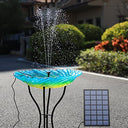 AMZtime DIY Solar Fountain with 6 nozzles and solar panel in a garden setting