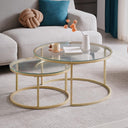 Set of 2 modern nesting coffee tables with glass top and gold finish