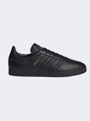 Adidas Gazelle men's original shoes featuring black and gold accents